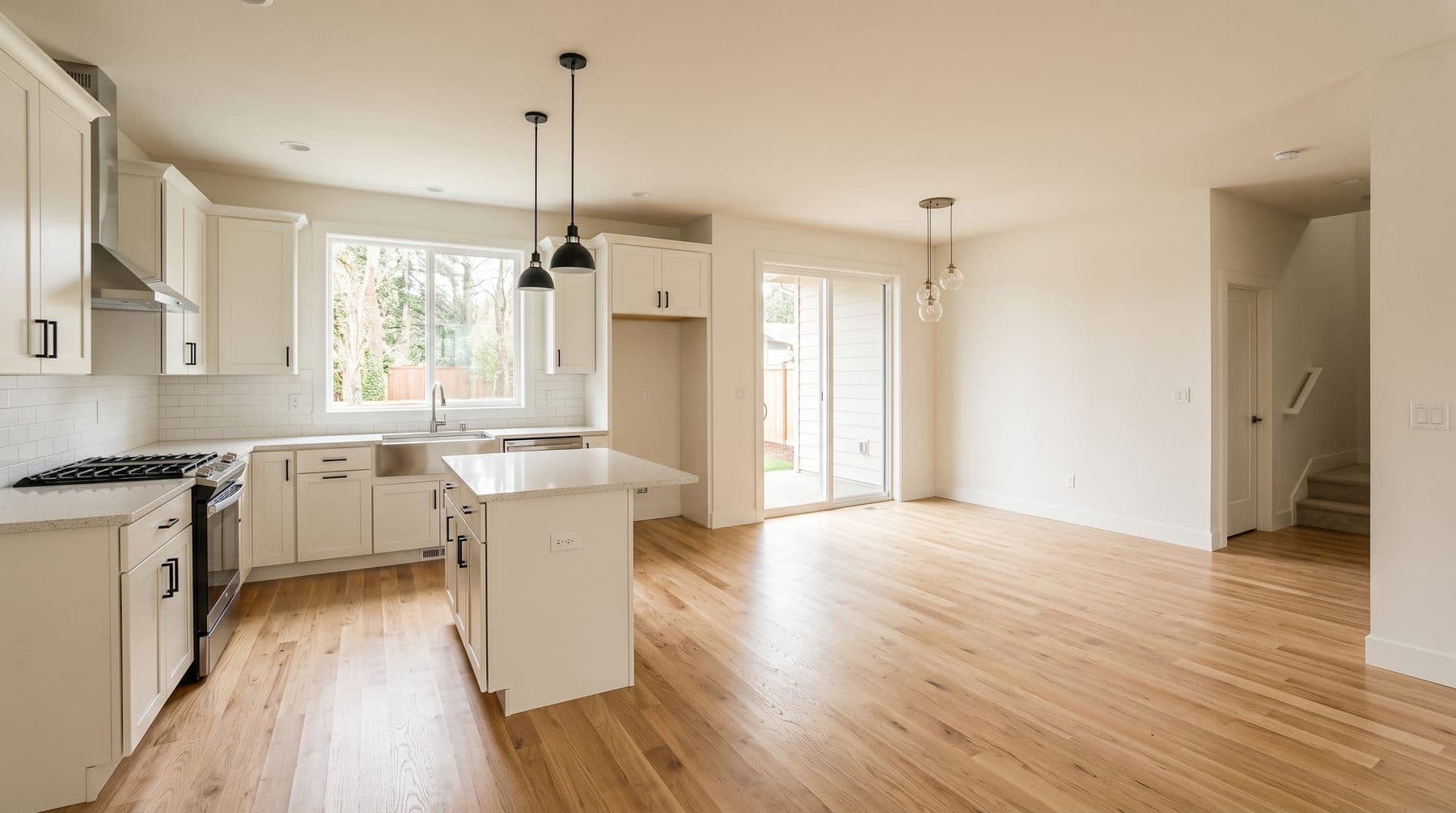 Empty, freshly cleaned kitchen and living area ready for move-in